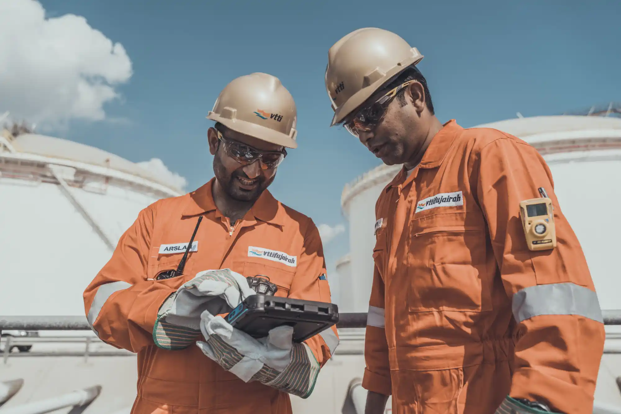 Photograph of 2 VTTI workers performing measurements at a terminal